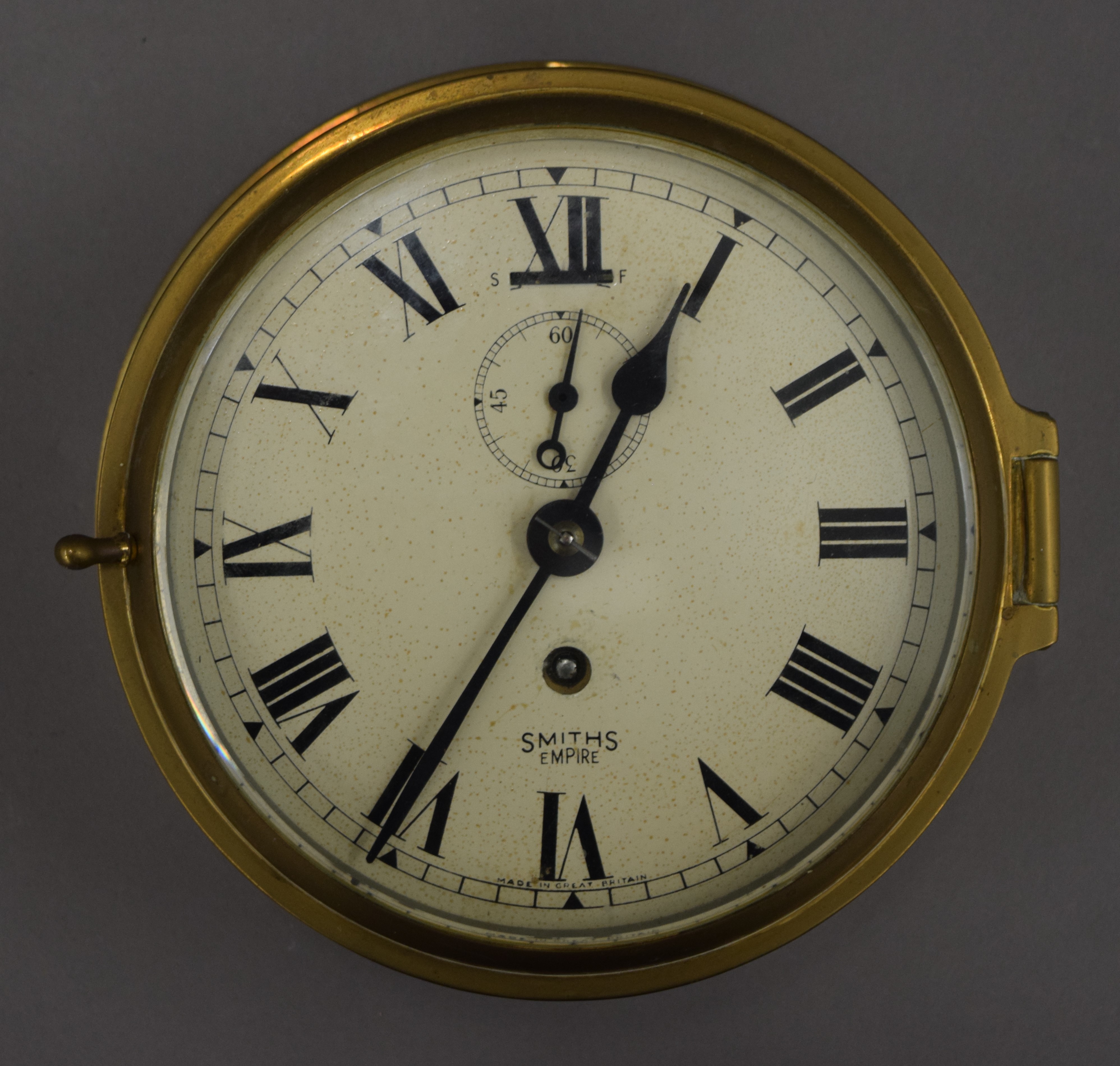 A Smith's brass bulk head clock. 18 cm diameter. - Image 2 of 3