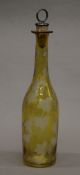 A 19th century etched glass yellow ground bottle. 30.5 cm high.