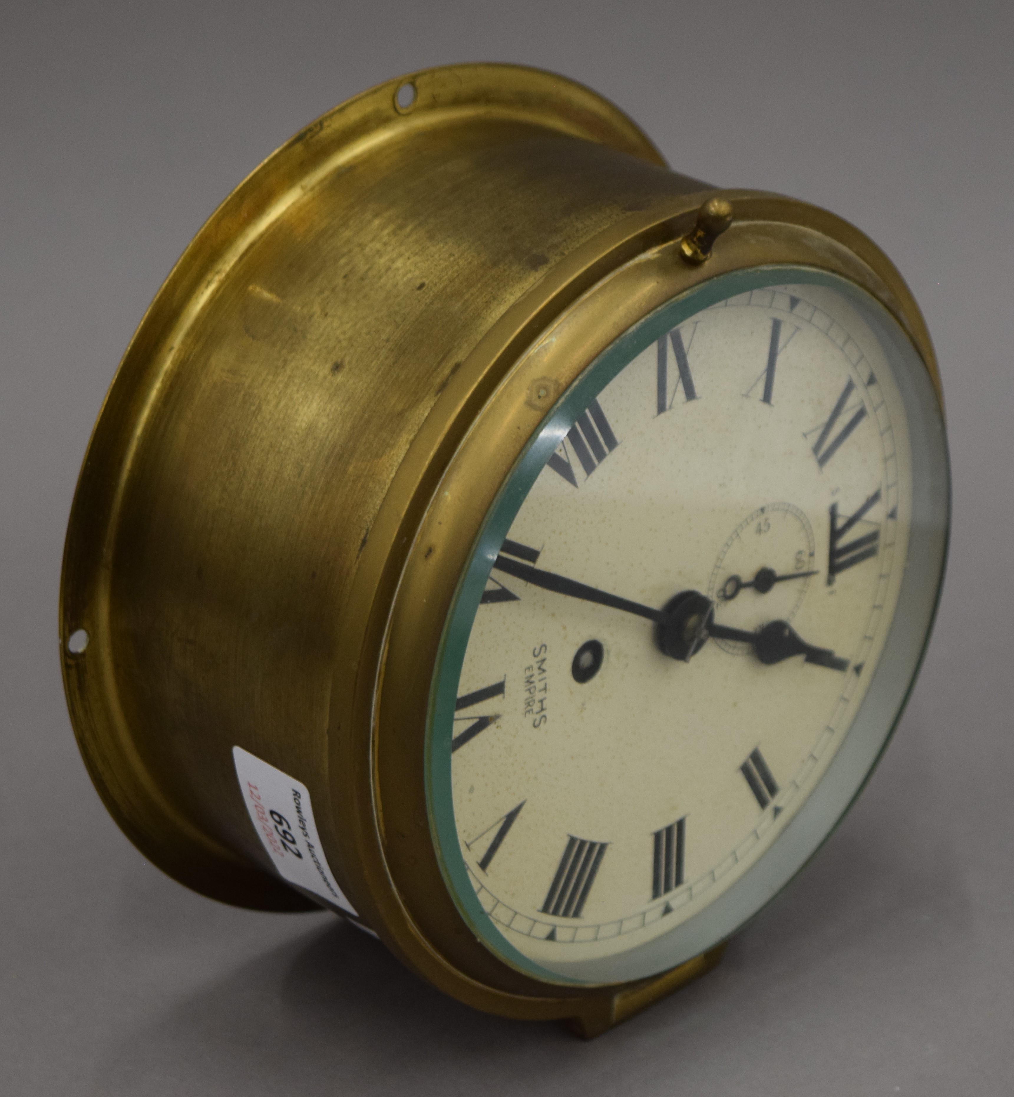 A Smith's brass bulk head clock. 18 cm diameter. - Image 3 of 3