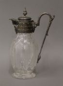 A silver plate mounted cut glass claret jug. 26 cm high.