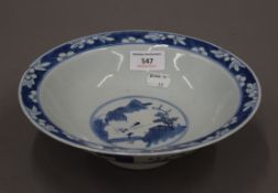 An 18th century Chinese porcelain blue and white footed shallow bowl, decorated with figures. 23.