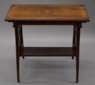 A Victorian inlaid rosewood side table. 76 cm long.