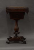 A Victorian inlaid rosewood games table. 45 cm wide.