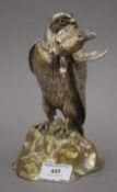 A silvered bronze inkwell formed as a bird of prey with a game bird in its beak. 20 cm high.
