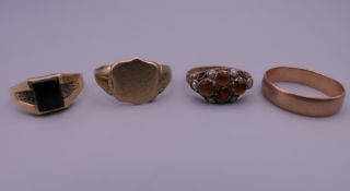 Four various 9 ct gold rings. 9.6 grammes total weight.