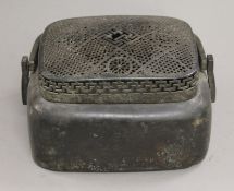 A Chinese pierced top censer with handle. 26 cm wide.