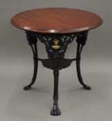 A Baden Powell cast iron pub table. 75 cm diameter.