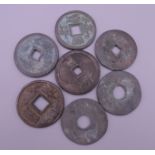 Seven Chinese coins. Each approximately 3 cm diameter.