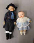 A vintage doll dressed as a girl guide and another. The former 35 cm high.