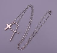 Two silver crosses on a silver chain. Chain 56 cm long, largest cross 3.5 cm high. 10.5 grammes.