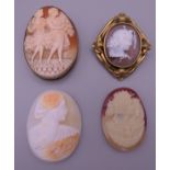 Two Victorian cameo brooches and two loose cameos. The largest 6 cm high overall.