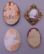 Two Victorian cameo brooches and two loose cameos. The largest 6 cm high overall.