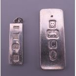 Two silver ingots. 4 cm and 2.75 cm high respectively. 26.4 grammes.