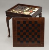 A small mahogany fitted games table. 45.5 cm wide.