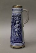 A 19th century German pottery stein with English silver mounts. 27.5 cm high.