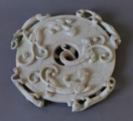 A Chinese carved bi disc. 25.5 cm diameter.