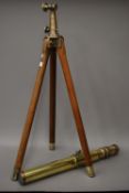 A WWI period military brass and bronze telescope, on original tripod (good working order). 65.