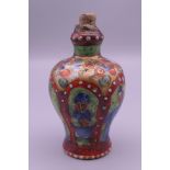 An 18th/19th century Chinese clobbered porcelain snuff bottle. 8 cm high.