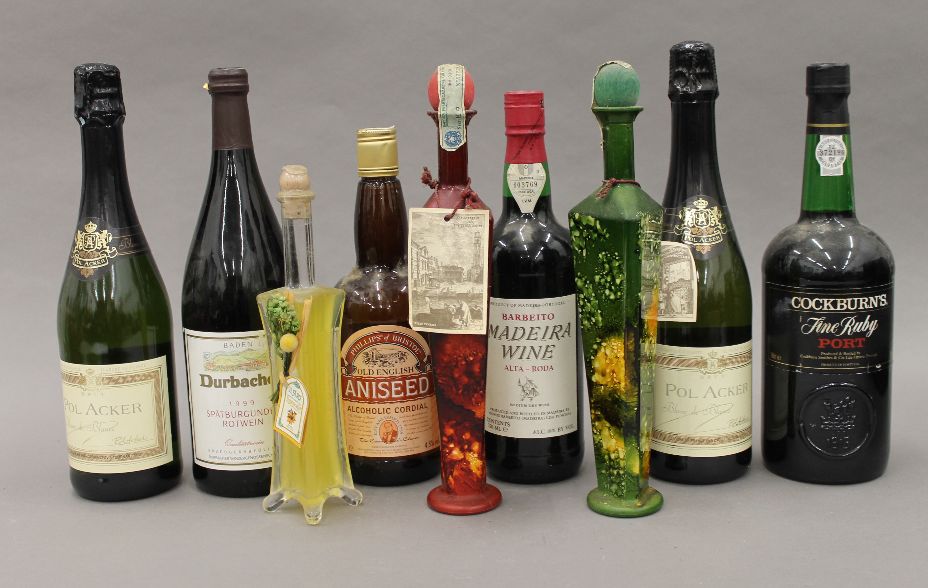 A quantity of various bottles of alcohol.