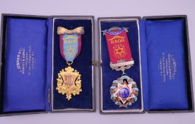 Two boxed silver RAOB Grand Council Buffalo medals. 13 cm high and 11 cm high respectively.