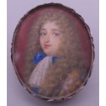 An 18th century silver mounted portrait miniature of a young gentleman. 3 cm high.