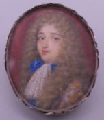 An 18th century silver mounted portrait miniature of a young gentleman. 3 cm high.