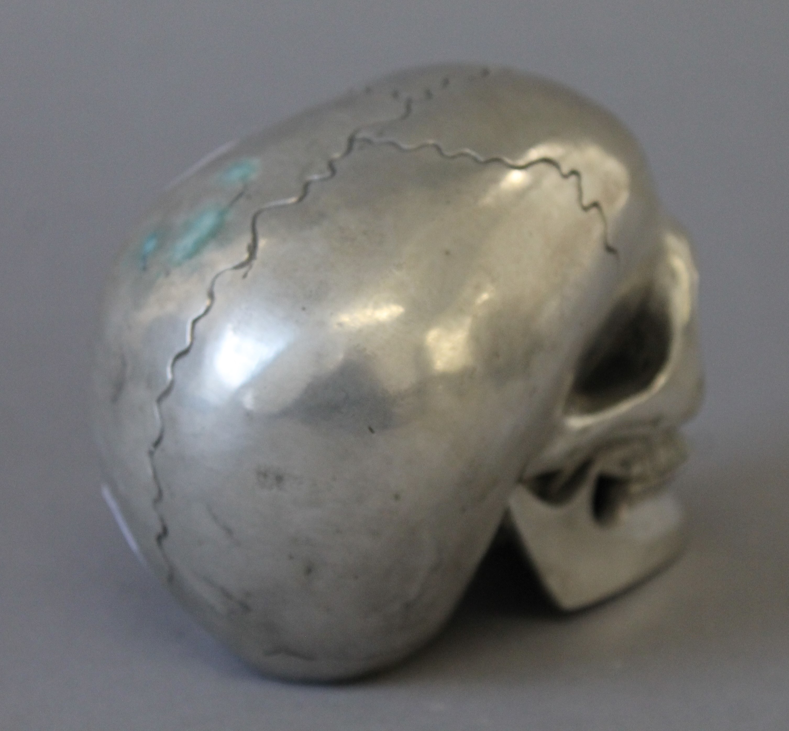 A silvered metal model of a skull. 9.5 cm high. - Image 3 of 3