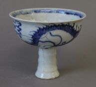 A Chinese blue and white porcelain stem cup. 11 cm high.