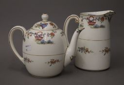 A Royal Worcester teapot and jug. The latter 17.5 cm high.