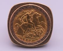 A 9 ct gold half sovereign ring. 12.6 grammes.