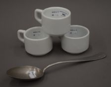 A Luftwaffe Messhall serving spoon and three coffee cups dated 1939. The former 30 cm long.