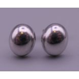 A pair of 9 ct white gold earrings. 1 cm high.