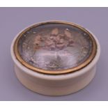 A 19th century ivory snuff box. 6.5 cm diameter.