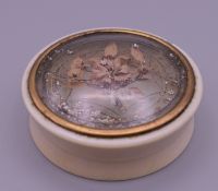 A 19th century ivory snuff box. 6.5 cm diameter.
