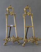 A pair of brass table easels. 41 cm high.