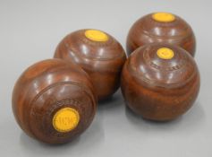 A set of four vintage bowling woods.