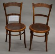 A pair of Thonet Bentwood chairs, each with a hand written name to the underside,