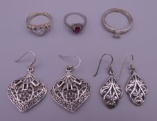 Three silver rings and two pairs of silver earrings. Largest earrings 3 cm x 2.75 cm. 18.