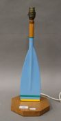 A painted wooden oar form table lamp. 44 cm high.