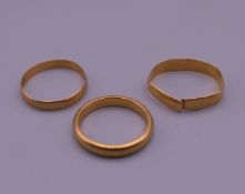 Three 22 ct gold wedding bands. 6.8 grammes.