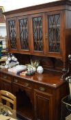 A Victorian walnut sideboard with glazed top. 152 cm wide.