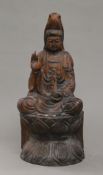 A carved wooden model of Guanyin. 40 cm high.