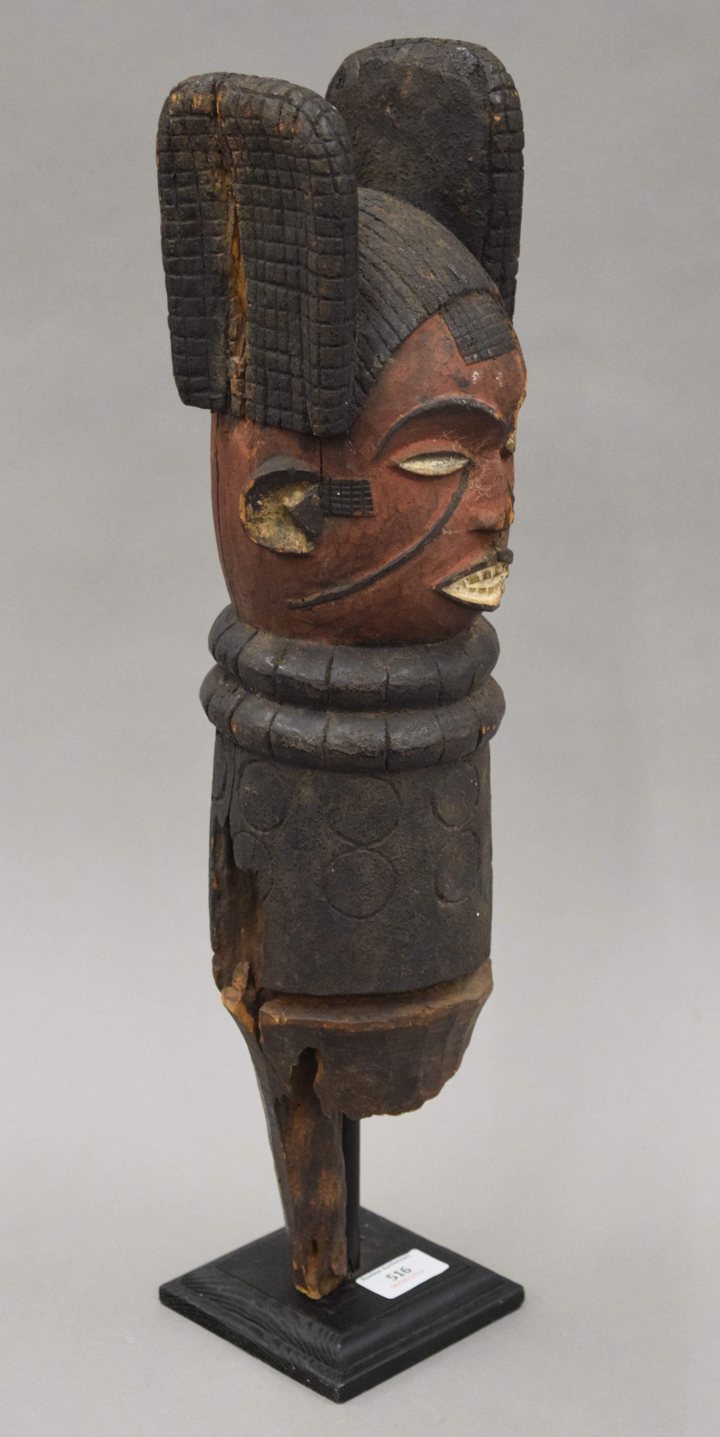 An African painted carved wooden tribal post, mounted on a display stand. 54 cm high overall. - Image 6 of 9
