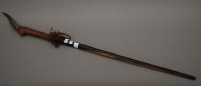 A leather clad antler mounted walking stick, the handle formed as an antelope. 95 cm long.