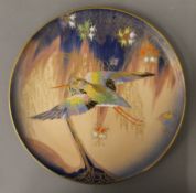 A Carltonware charger decorated with a bird. 32 cm diameter.