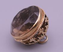 A 9 ct gold mounted smoky quartz fob. 2 cm high overall. 10.7 grammes total weight.