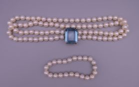 A gold, aquamarine and pearl choker necklace and bracelet. Necklace 37.5 cm long, bracelet 17.