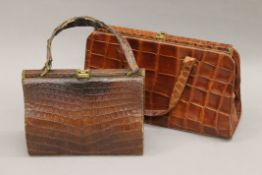 Two crocodile skin handbags. The largest 34 cm wide.