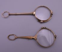 Two gold plated lorgnettes. 11 cm and 12 cm long respectively.