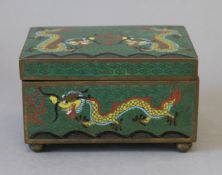 A green cloisonne dragon box. 11.5 cm wide.